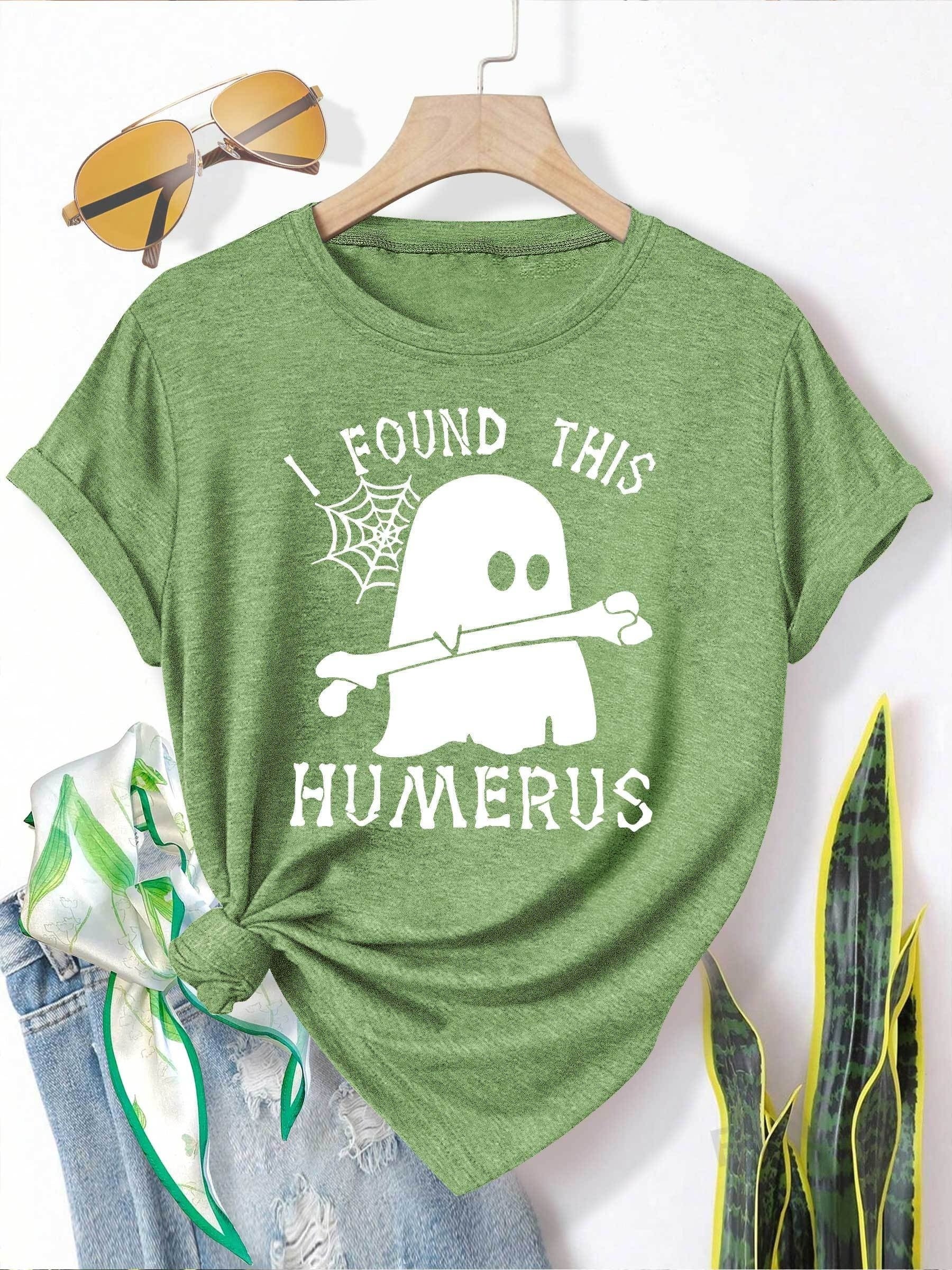 [Humor Graphic T-Shirt] Funny Humor Graphic T-Shirt for Women - "I Found This Humerus" Slogan & Mummy-Wrapped Skeleton Nurse Design | Casual Round Neck Short Sleeve Tee for Halloween, Themed Parties & Casual Attire, Machine Washable All-Season Comfort