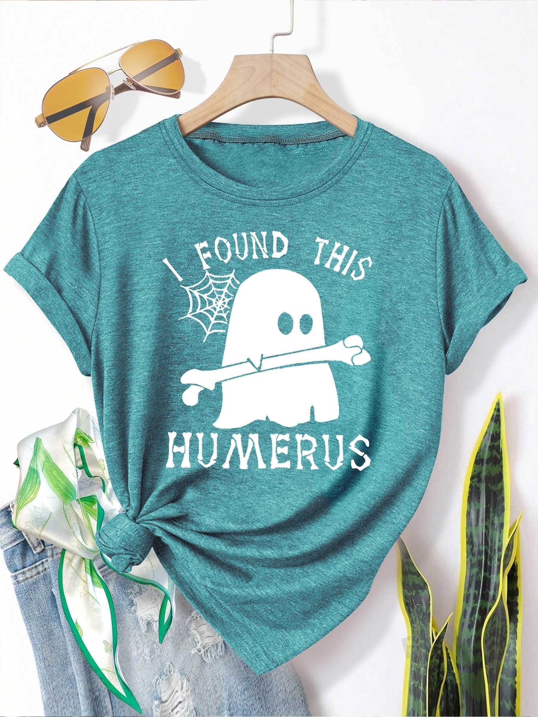 [Humor Graphic T-Shirt] Funny Humor Graphic T-Shirt for Women - "I Found This Humerus" Slogan & Mummy-Wrapped Skeleton Nurse Design | Casual Round Neck Short Sleeve Tee for Halloween, Themed Parties & Casual Attire, Machine Washable All-Season Comfort