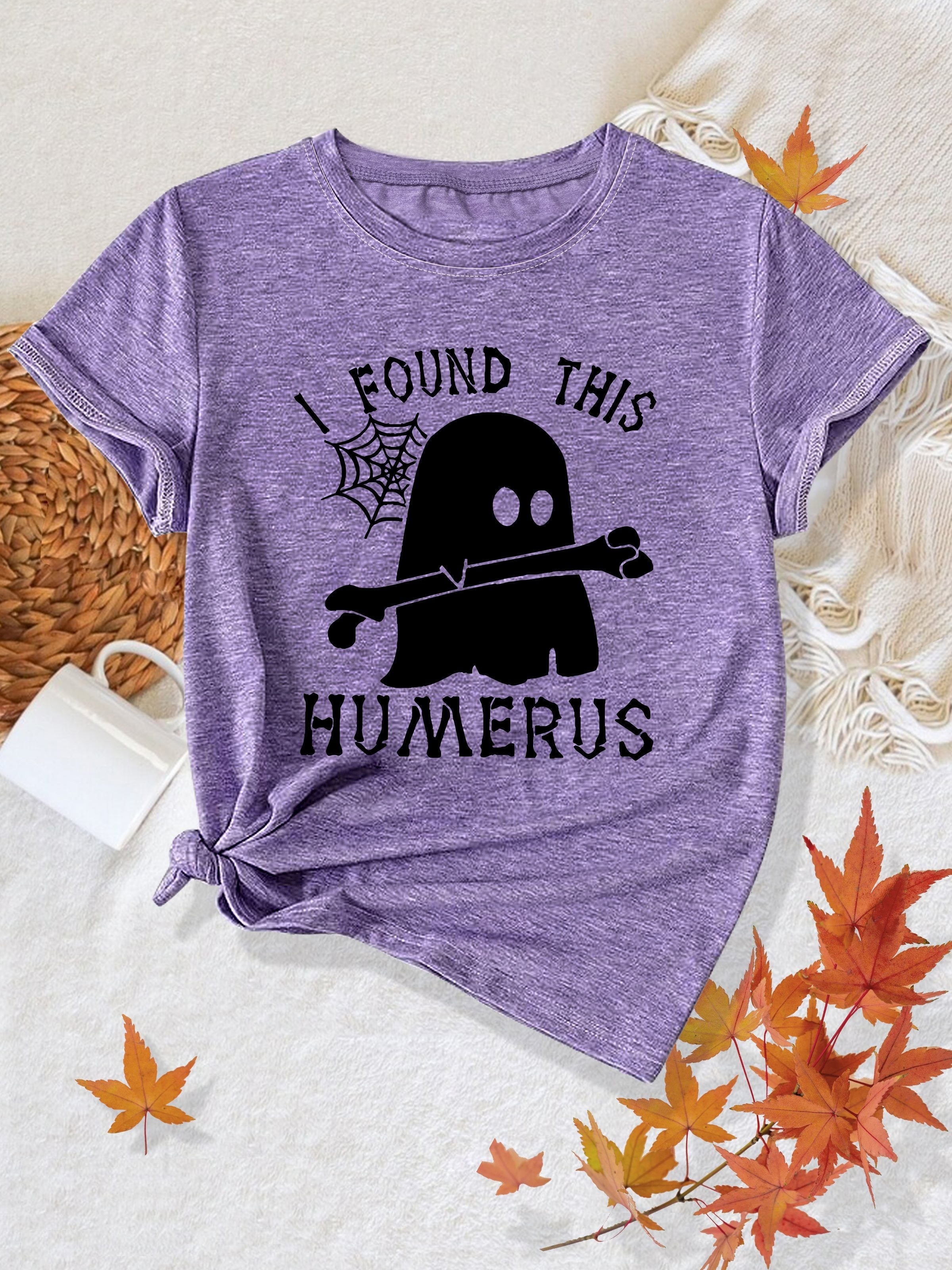 [Humor Graphic T-Shirt] Funny Humor Graphic T-Shirt for Women - "I Found This Humerus" Slogan & Mummy-Wrapped Skeleton Nurse Design | Casual Round Neck Short Sleeve Tee for Halloween, Themed Parties & Casual Attire, Machine Washable All-Season Comfort
