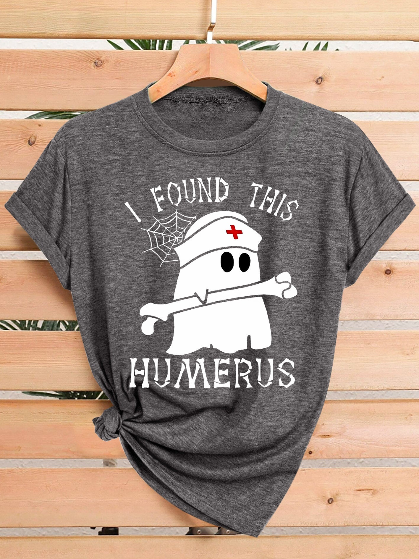 [Humor Graphic T-Shirt] Funny Humor Graphic T-Shirt for Women - "I Found This Humerus" Slogan & Mummy-Wrapped Skeleton Nurse Design | Casual Round Neck Short Sleeve Tee for Halloween, Themed Parties & Casual Attire, Machine Washable All-Season Comfort