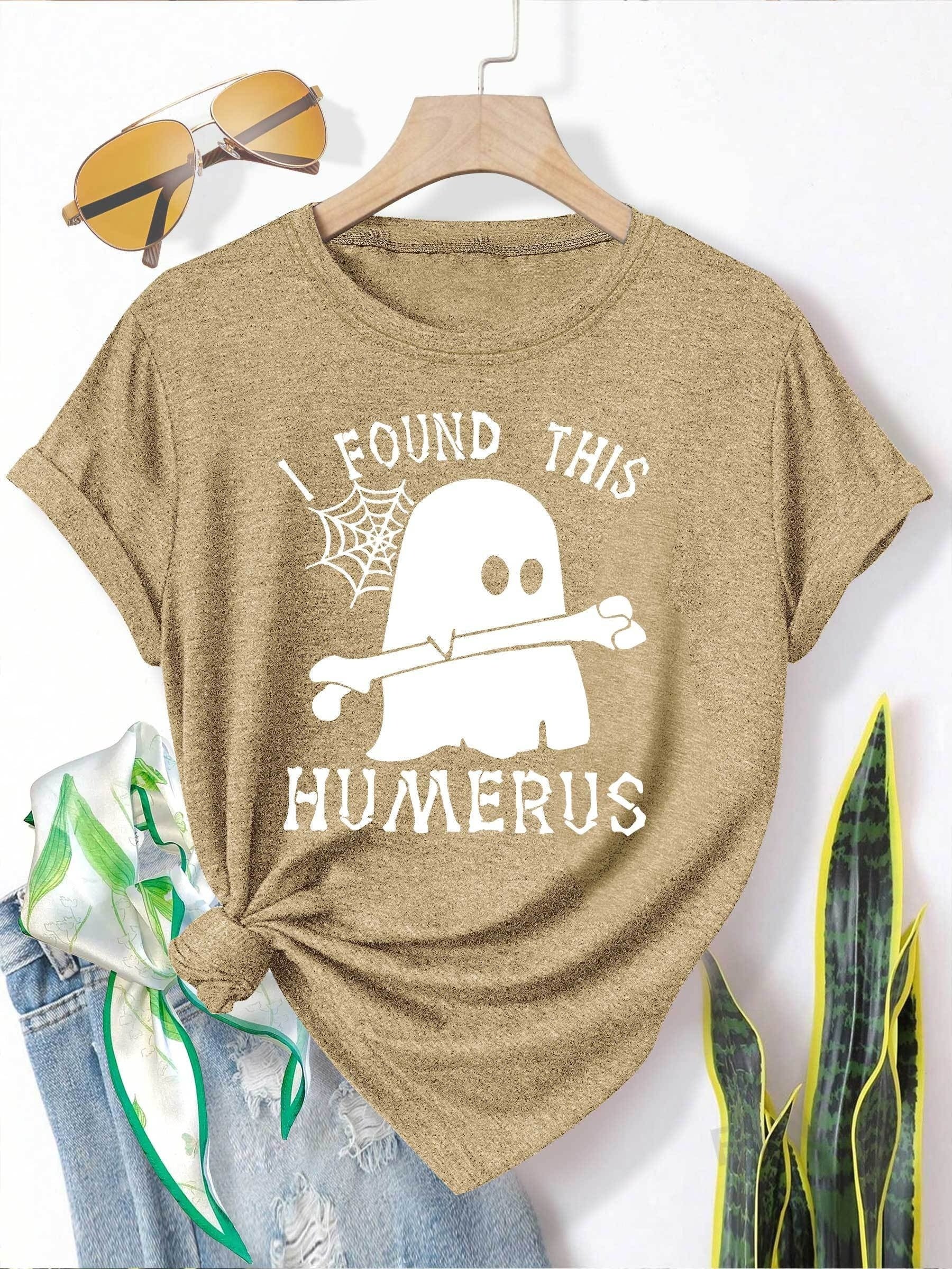 [Humor Graphic T-Shirt] Funny Humor Graphic T-Shirt for Women - "I Found This Humerus" Slogan & Mummy-Wrapped Skeleton Nurse Design | Casual Round Neck Short Sleeve Tee for Halloween, Themed Parties & Casual Attire, Machine Washable All-Season Comfort